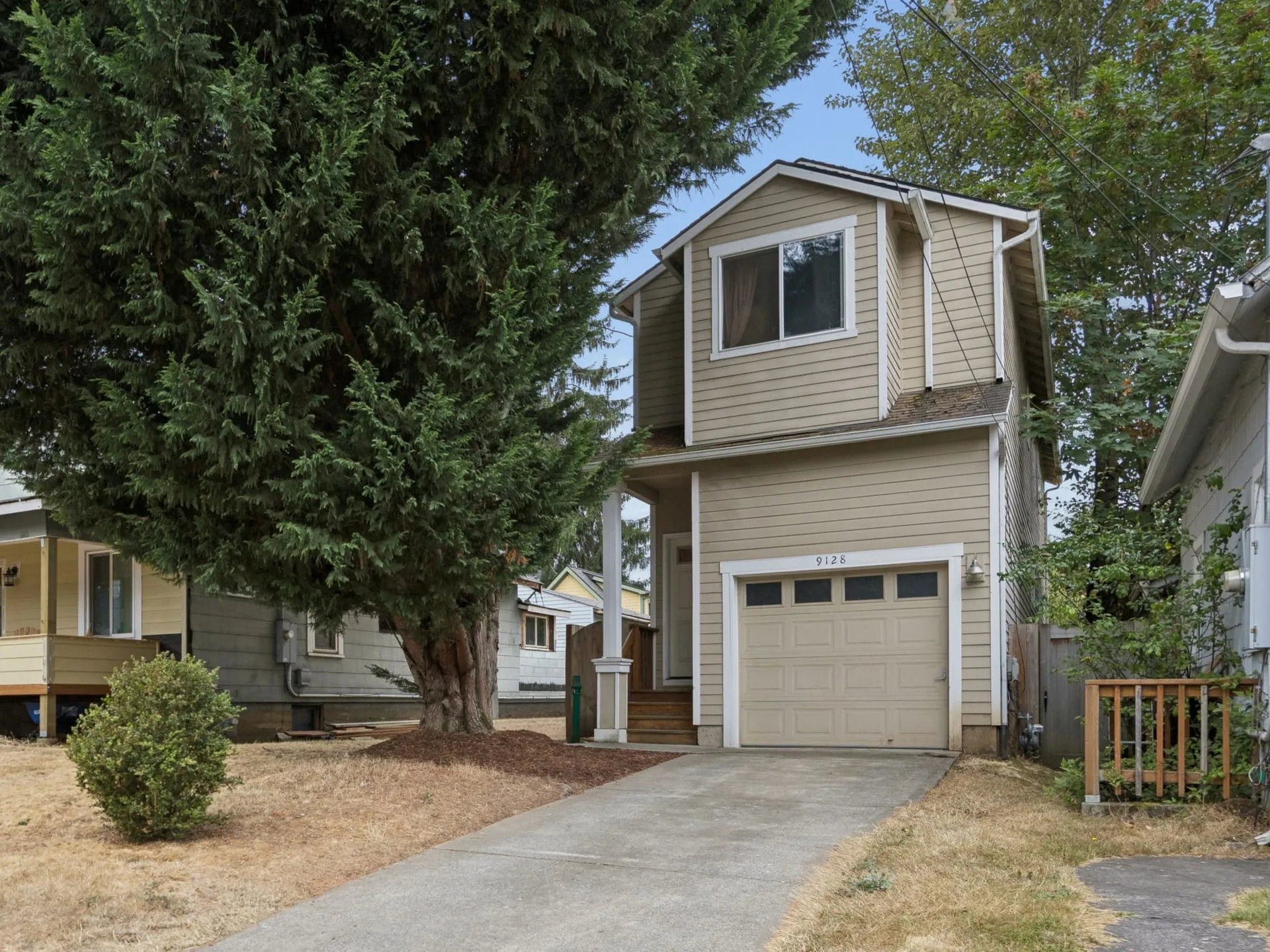 Front of the home with attached garage and driveway