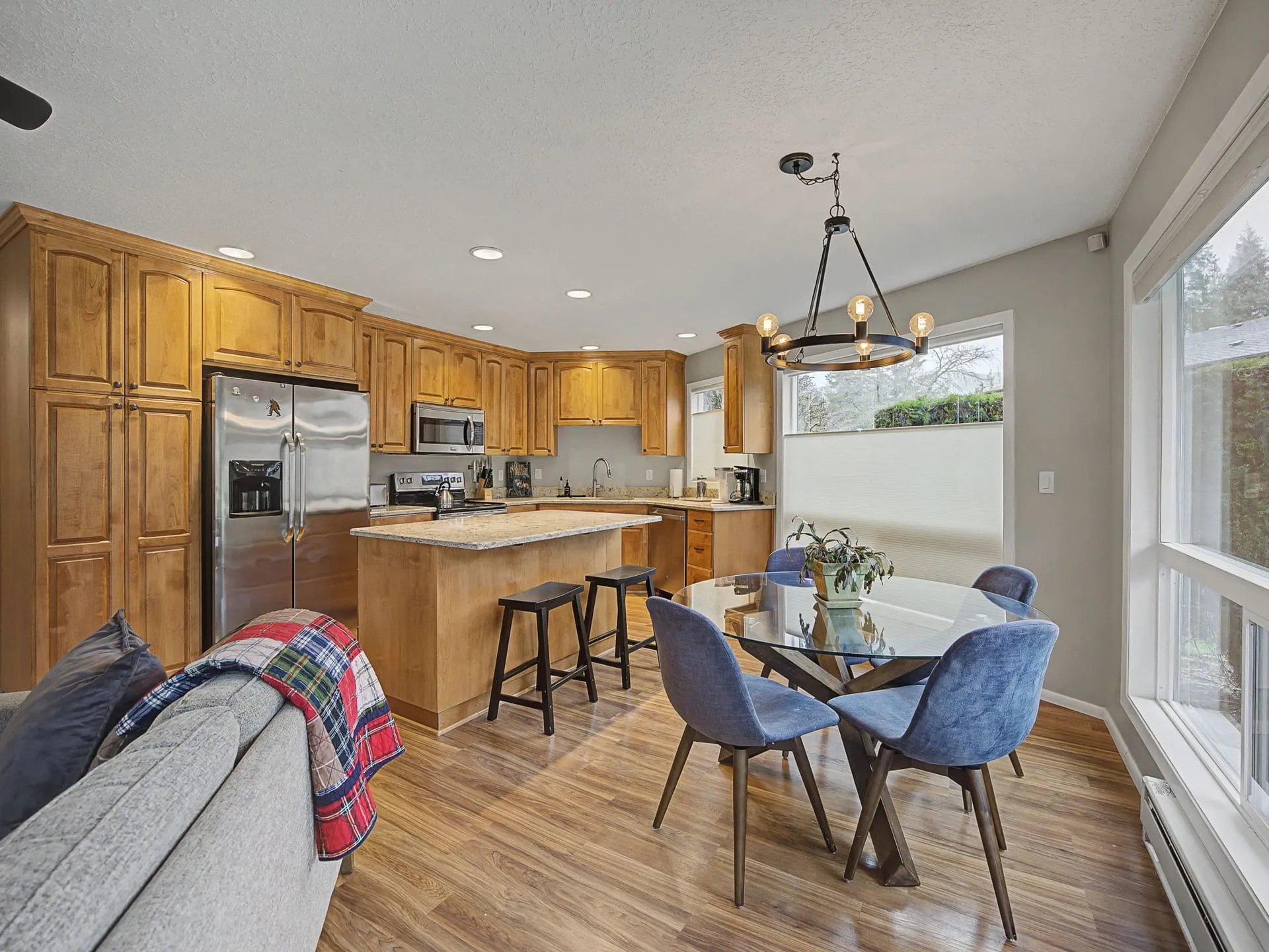 Updated kitchen with island and dining area