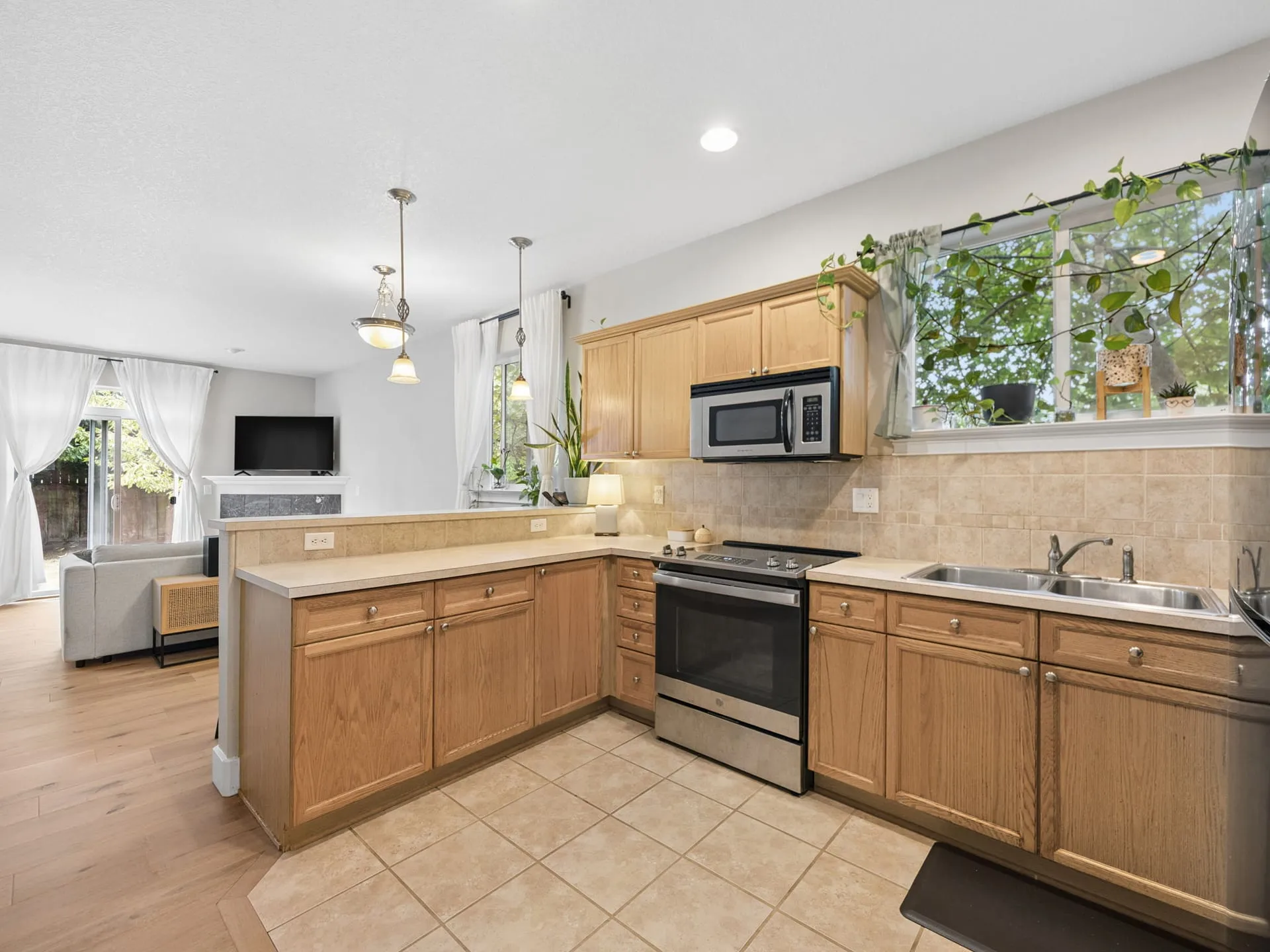 Kitchen with tile backsplash and eat-in bar