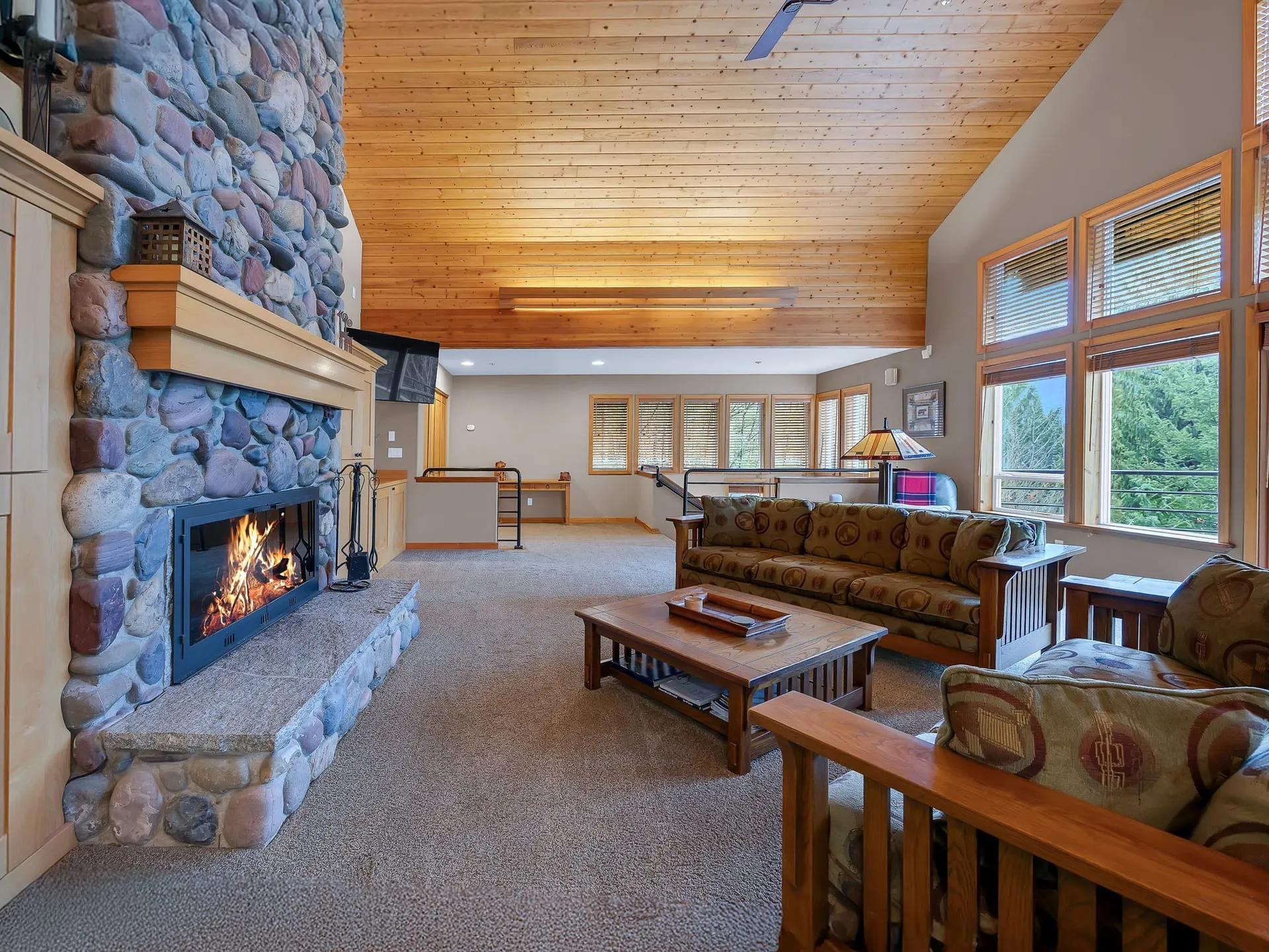 Seating area around the stone fireplace