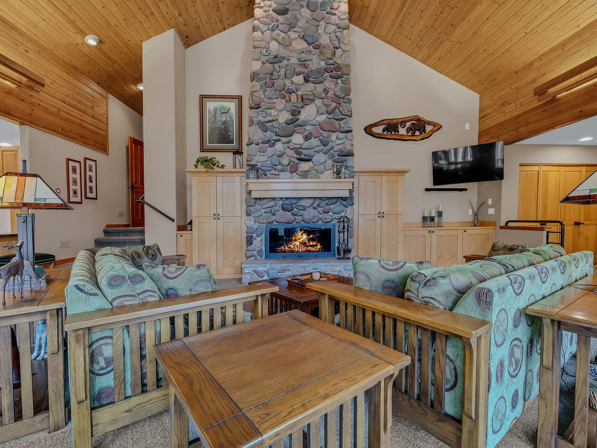 The great room fireplace seen from the sitting area